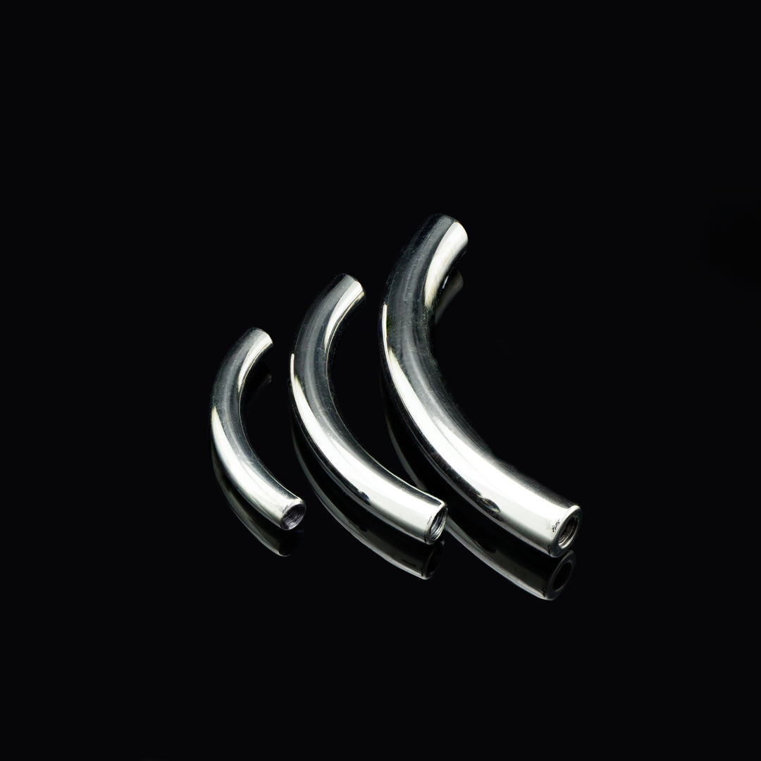 Three silver color curves bars on a black background.