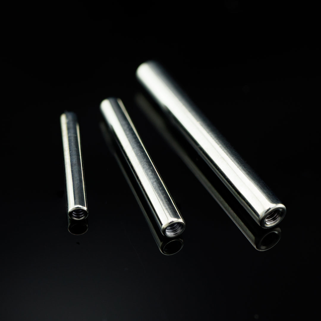 Three silver colored bars in varying sizes on a black background.