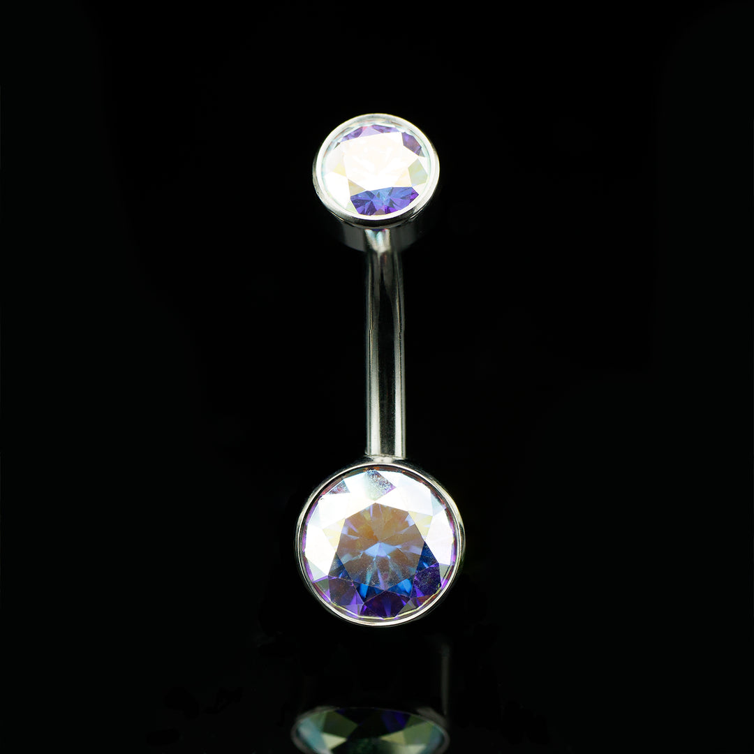 Navel curve with round iridescent gemstones at the top and the bottom on a black background.