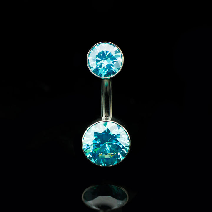 Navel curve with Mint colored gemstones on a black background.