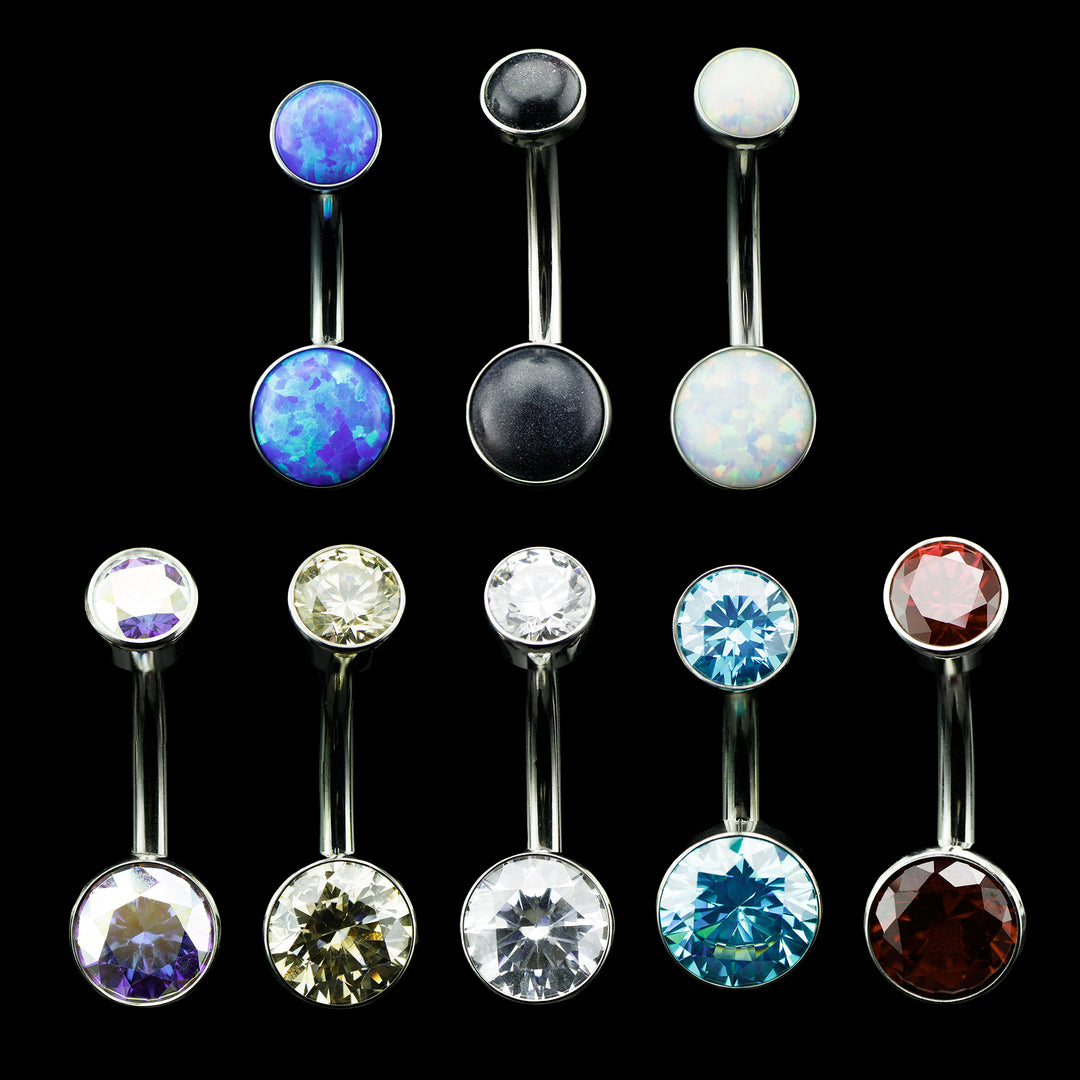 Set of Navel curves in various colors for belly button piercings on a black background.