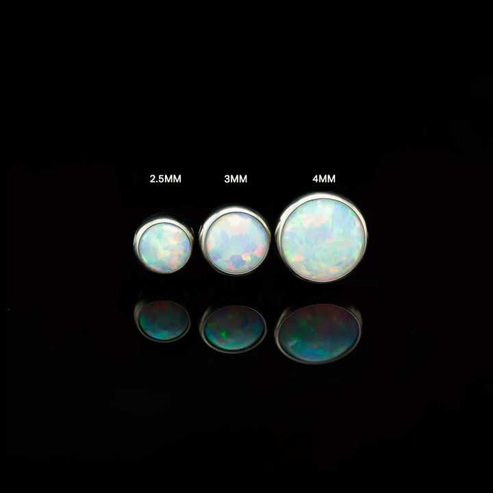Three sizes of the white opal end with size labels on a black background.
