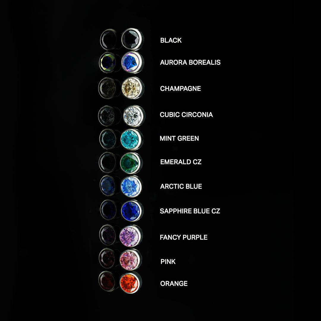 Column of bezel set cubic zirconia in various colors with on a black background. Each color is labeled.