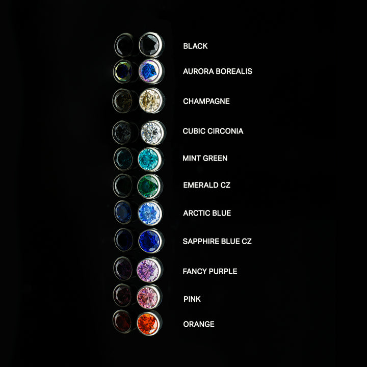 Column of bezel set cubic zirconia in various colors with on a black background. Each color is labeled.