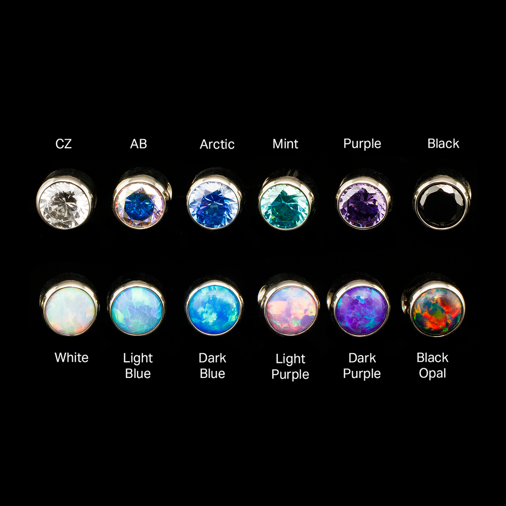 Captive gems in varying colors on a black background with color labels