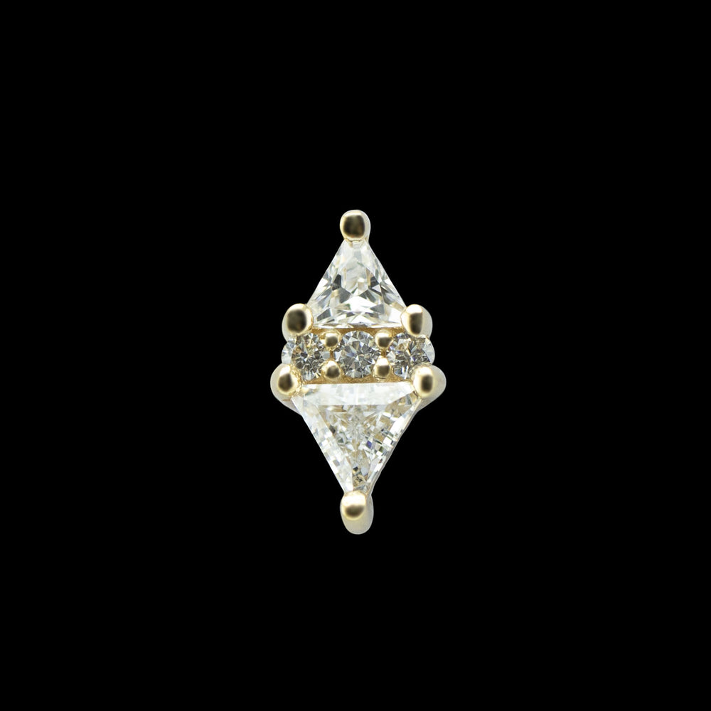 A yellow gold piece of body jewelry on a solid black background.  This piece consist of two trillion cut Cubic zirconia with the points facing out and 3 smaller round cut cubic zirconia sandwiched between the two triangular shaped CZs. 