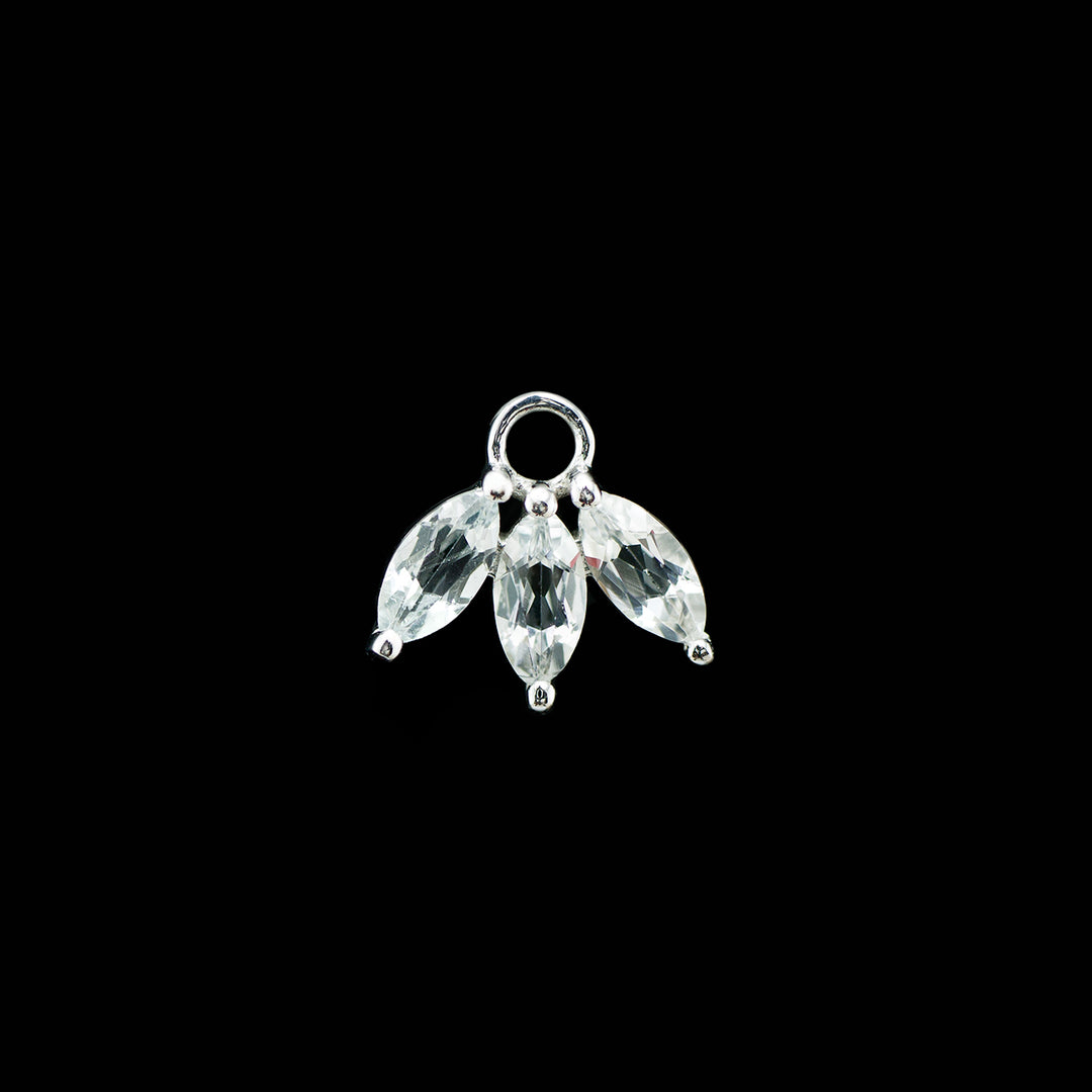White gold charm with three marquise cut white cubic zirconia set in a fan shape on a black background,