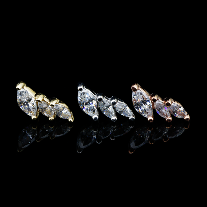Three Multiplicity ends on a black background. This design consists of three marquise cut cubic zirconia leaning to either the left or right.