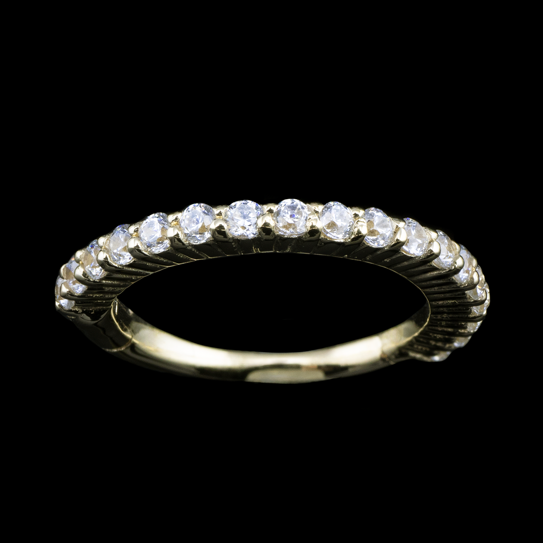 Yellow god ring with white cubic zirconia set throughout. The gemstones on this ring face outward, making it a good piece for helix, conch, and earlobes.