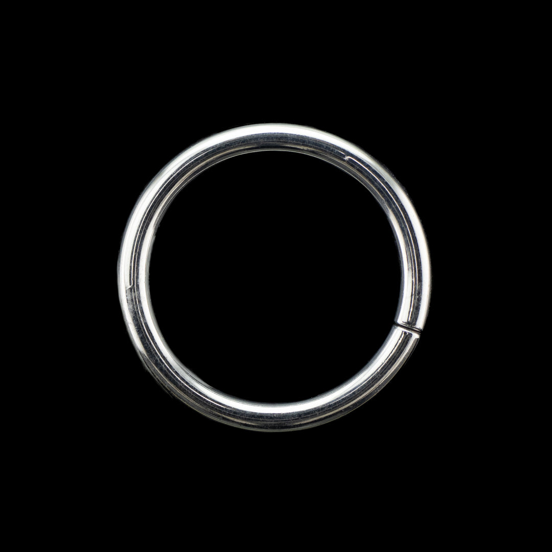 Solid white gold seamless hoop on a black background. A simple high polish ring for belly, navel, nostril, daith, cartilage, helix, rook, tragus, earlobe piercings. 